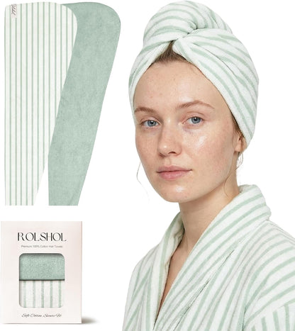 ROLSHOL cotton hair towel wrap in light green and white stripes, shown flat (both sides) and worn as a turban by a woman in a matching robe. Packaging box below reads 'ROLSHOL Premium 100% Cotton Hair Towels.'