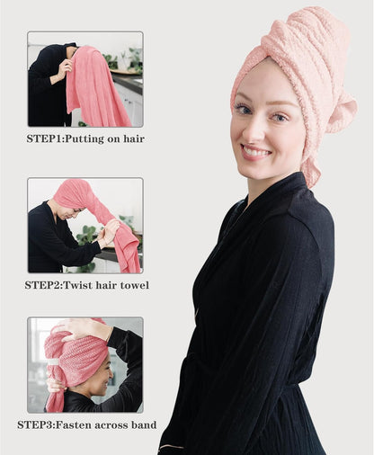 Instructional image showing a pink hair towel wrap in 3 steps: Step 1: Putting on hair, Step 2: Twist hair towel, Step 3: Fasten across band. Main image shows a woman wearing the towel wrapped on her head.
