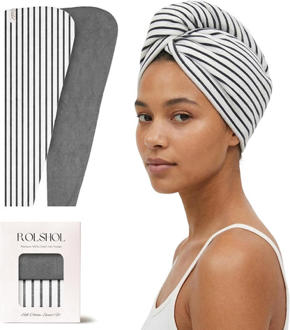 ROLSHOL hair towel wrap shown flat (white with black stripes, gray reverse side), worn as a turban on a woman, and in branded packaging. Label reads 'Premium 100% Cotton Hair Towels.'