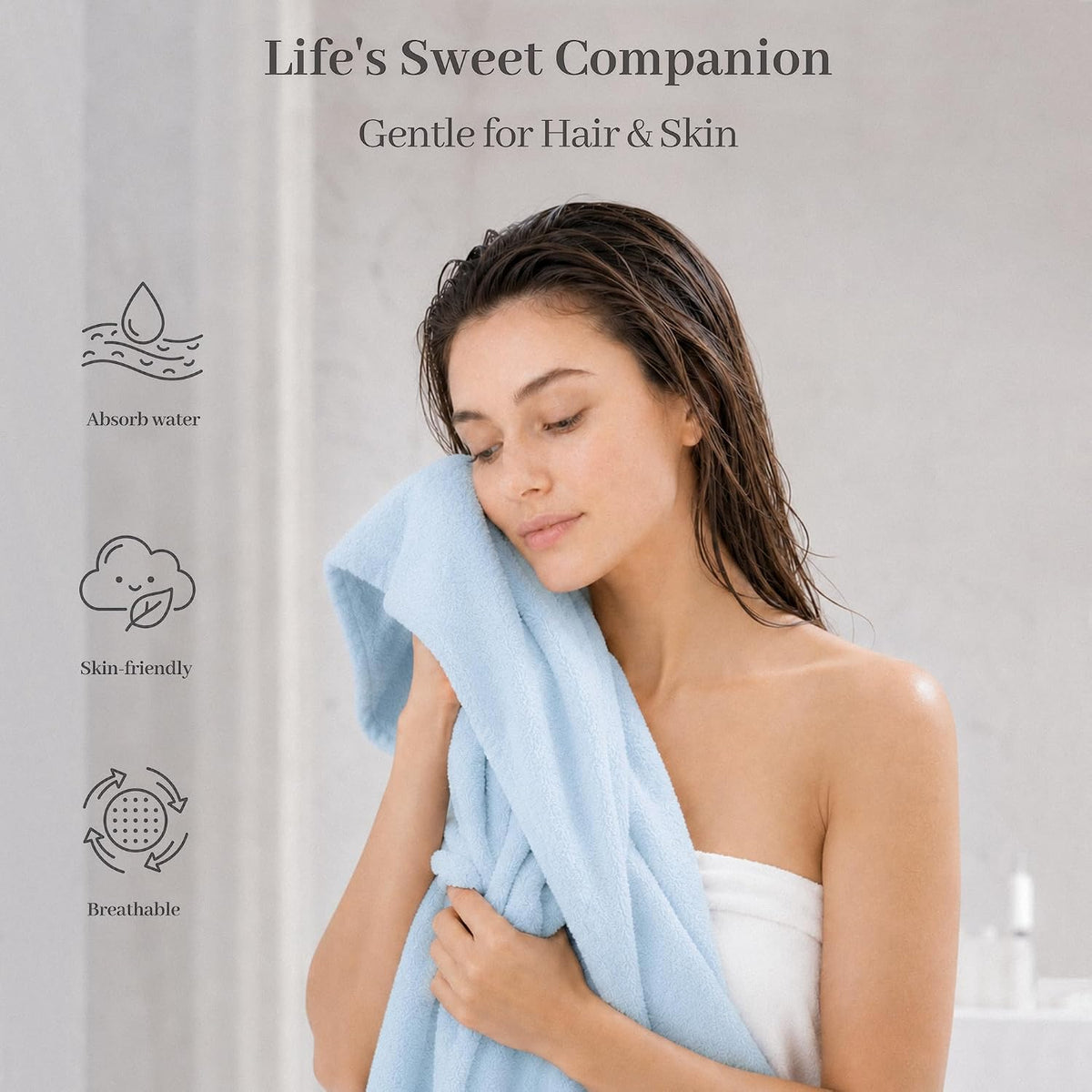 Promotional banner for a light blue cotton towel. A woman with wet hair gently presses the soft blue towel to her face. Left side shows three feature icons: Absorb water, Skin-friendly, and Breathable. Header reads 'Life's Sweet Companion, Gentle for Hair & Skin'.
