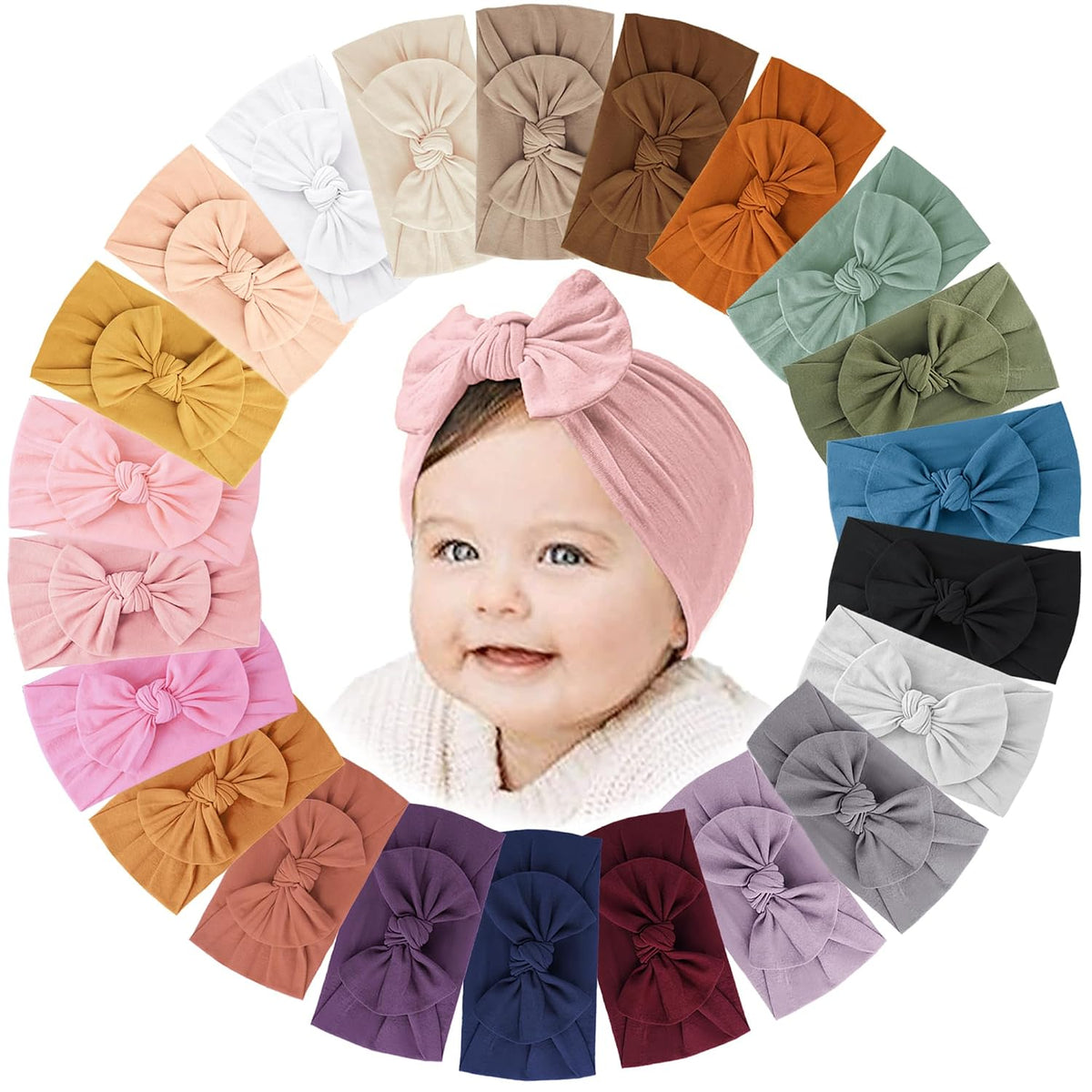 Circular arrangement of 22 soft fabric baby headbands with knotted bows in various colors surrounding a smiling baby wearing a dusty pink bow headband. Colors include white, peach, mustard, pink, mauve, navy, burgundy, lavender, gray, black, teal, sage, rust, and tan.