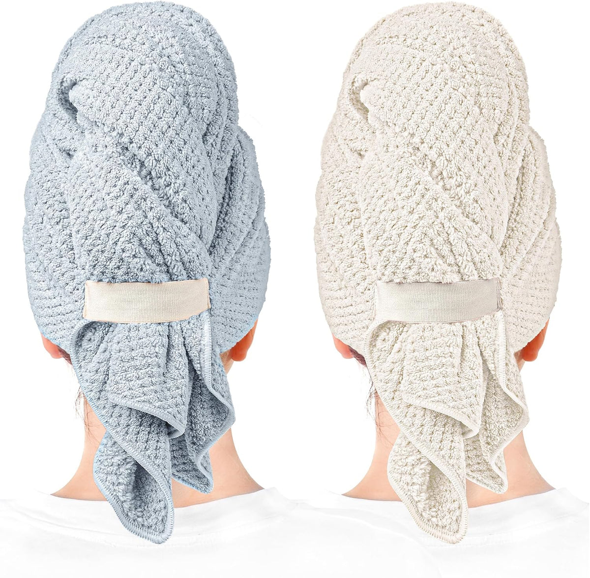 Two hair towel wraps shown worn on the backs of heads: one in muted blue and one in light beige/cream. Both feature a waffle-knit texture, a fabric button loop closure, and a draped tail hanging at the nape.