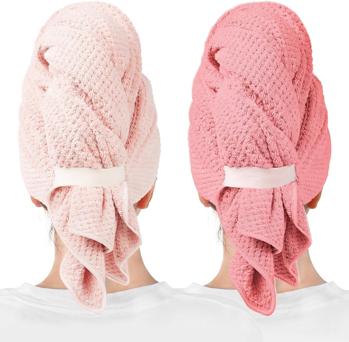 Two hair towel wraps worn on the backs of heads: one light pink and one coral pink. Both feature a waffle-knit texture, a white elastic band closure, and a draped tail section hanging down.