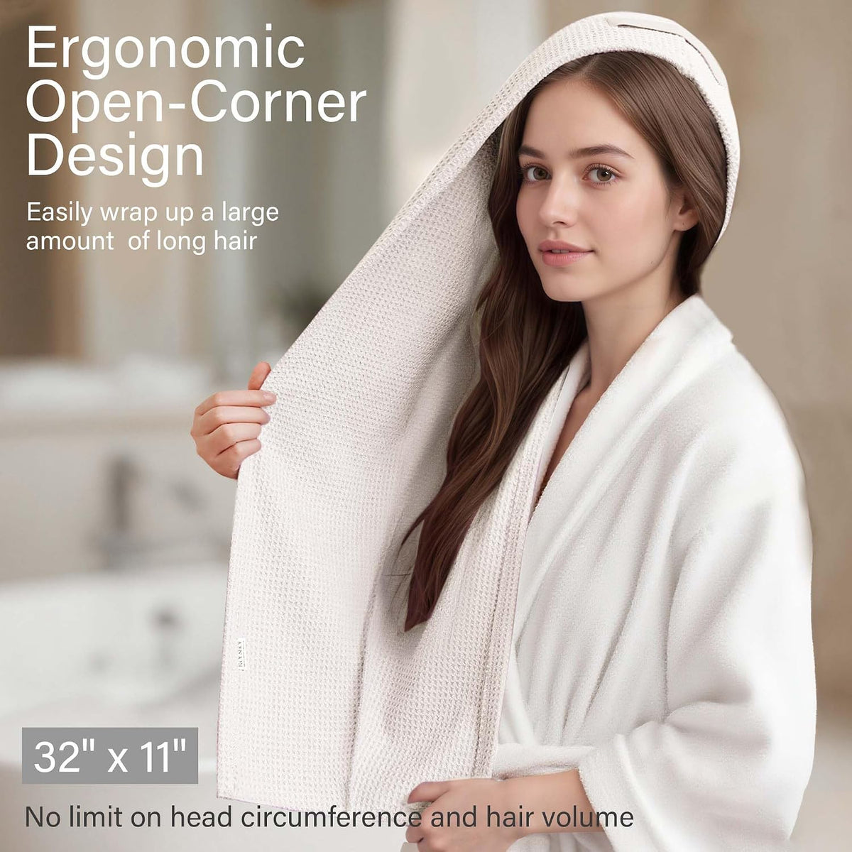 Promotional image of a cream waffle-weave hair towel wrap shown on a woman with long hair in a bathroom setting. Text reads 'Ergonomic Open-Corner Design' and dimensions '32" x 11"'.